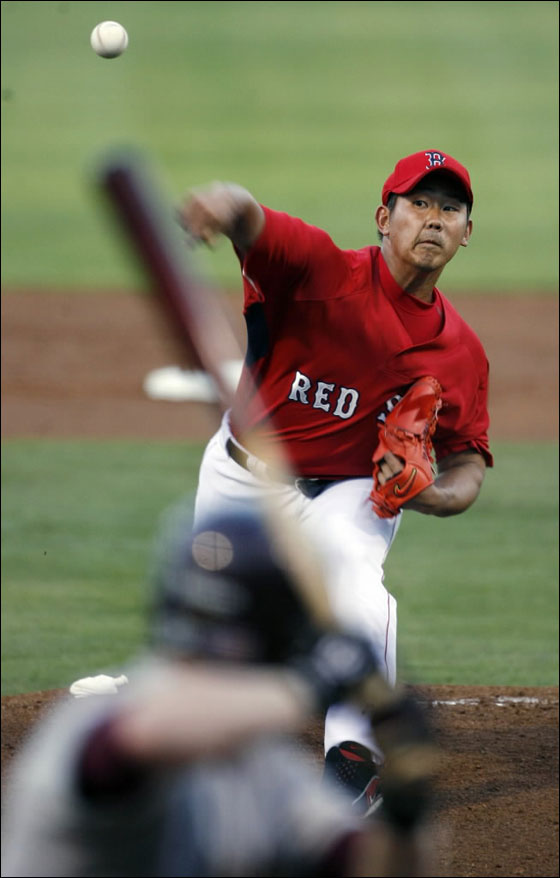 Red Sox pitcher Daisuke Matsuzaka fires a pitch during tonight's game vs. Boston College at City of Palms Park.