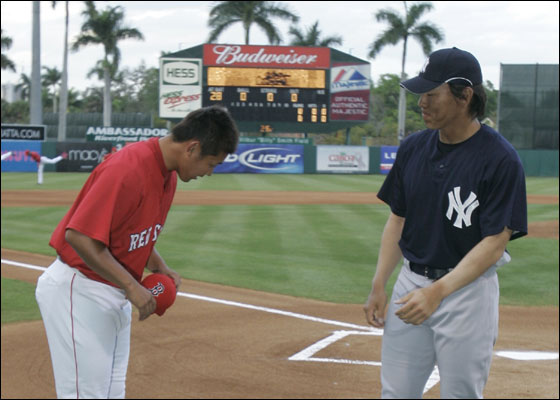 Red Sox pitcher Daisuke Matsuzaka, left, and New York Yankees outfielder Hideki Matsui greet at home plate prior to their spring training baseball game in Fort Myers, Fla., Monday, March 12, 2007.