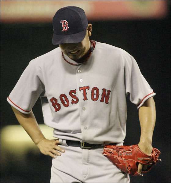 Red Sox pitcher Daisuke Matsuzaka, of Japan, reacts as he walks off the field after the third inning of a baseball game against the Texas Rangers, Friday, May 25, 2007, in Arlington, Texas.