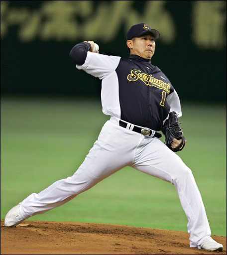 Japanese pitcher Daisuke Matsuzaka throws out an opening pitch during an exhibition game between his semiprofessional ball club Yokohama Samurai and the Ibaraki Golden Golds at Tokyo Dome in Tokyo Sunday, Jan. 7, 2007. Matsuzaka joined the Boston Red Sox on Dec. 14 2006, on a six-year, $52-million contract.