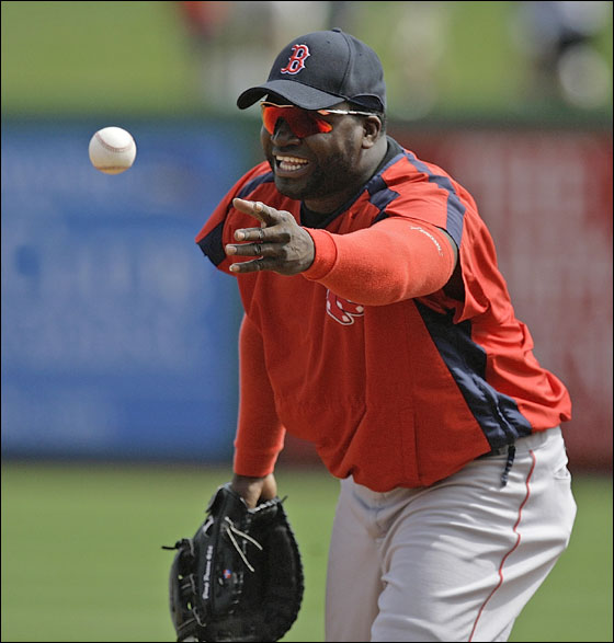 Boston Red Sox first baseman David Ortiz tosses a ball to first while taking fielding practice before the Red Sox faced the Philadelphia Phillies in their spring training baseball game in Clearwater, Fla., Thursday, March 22, 2007. 