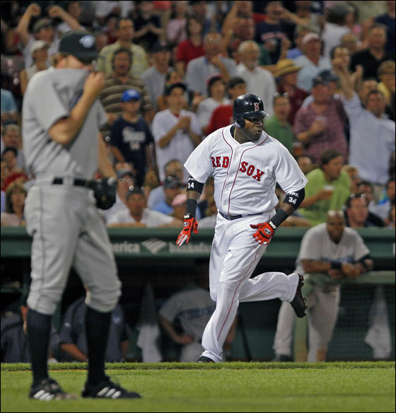 Red Sox DH David Ortiz, he of the balky right knee, motors toward the plate on it as he scores on a Manny Rqmirez sixth inning double off of Toronto reliever Casey Janssen