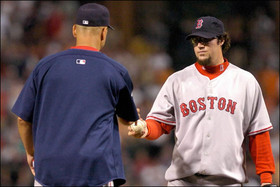 Eric Gagne of the Red Sox hands the ball to Manager Terry Francona after giving up 4 runs in the eighth inning against the Baltimore Orioles at Camden Yards August 10, 2007 in Baltimore, Maryland.