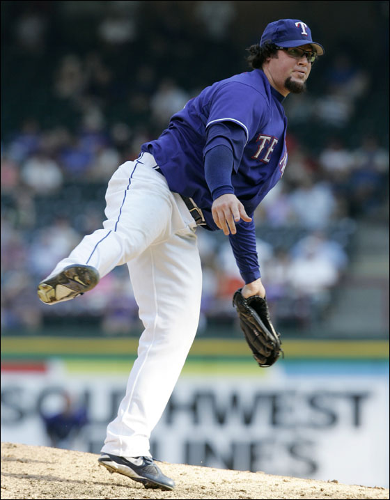 Texas Rangers pitcher Eric Gagne follows through on his delivery to the Seattle Mariners in the ninth inning of the first game of their baseball doubleheader in Arlington, Texas, Tuesday, July 24, 2007
