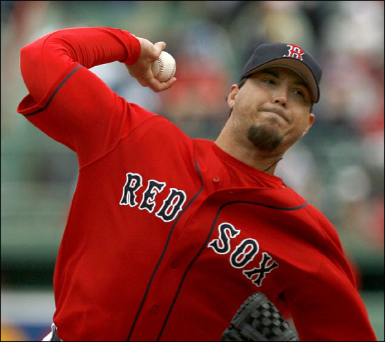 Red Sox starting pitcher Josh Beckett delivers a pitch during first inning action against the Mariners at Fenway Park on Sunday