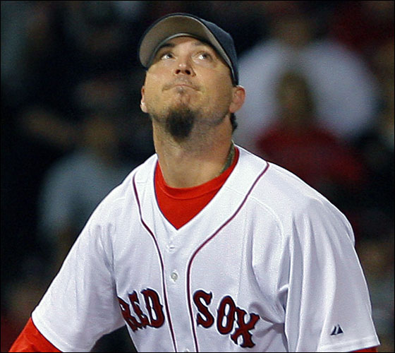 Red Sox pitcher Josh Beckett cranes his neck as he watches Greg Norton's first inning two out two run home run sail out of the park.