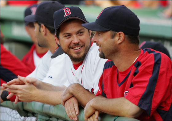 Josh Beckett No. 19 and Tim Wakefield No. 49 of the Red Sox have a laugh before playing the New York Mets on June 27, 2006 at Fenway Park in Boston.