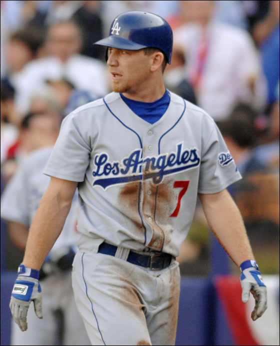 Los Angeles Dodgers' J.D. Drew heads to the dugout after being tagged out at home plate in the second inning of the first game of the National League Division Series against the New York Metsat Shea Stadium in New York on Wednesday, Oct. 4, 2006.