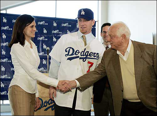 Dec. 2004: Los Angeles Dodgers icon and senior vice president Tommy Lasorda, right, greets Sheigh Drew, left, wife of new Dodgers outfielder J.D. Drew. The Dodgers and Drew finalized a five-year, $55 million deal Thursday in Los Angeles.