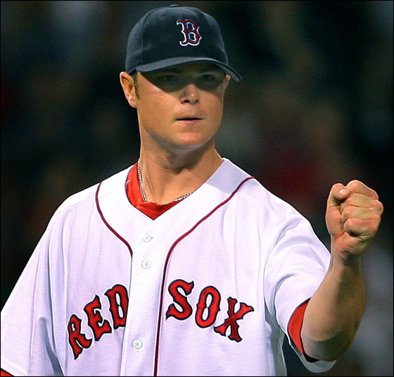 Red Sox starter Jon Lester pumps his fist after getting Mark Teahen to hit into a seventh inning ending double play.