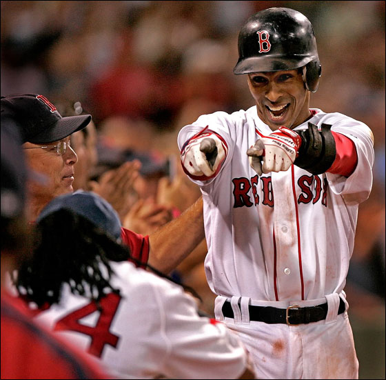 Julio Lugo points to Manny Ramirez as he approaches the dugout after his 8th inning grand slam.