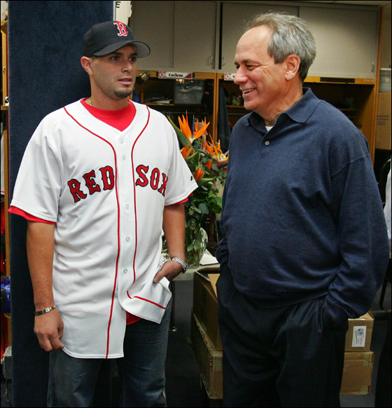The Red Sox signed pitcher Joel Pineiro, left to a one year contract as he talks to Larry Lucchino (CEO/President) before a press conference in the Red Sox Clubhouse on Thursday January 4, 2007.