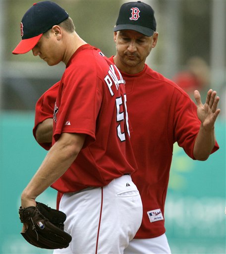 Boston Red Sox starting pitcher Jon Papelbon gets a pat on the back from manager Terry Francona after getting pulled against the Minnesota Twins during the fourth inning of their spring training baseball game in Fort Myers, Fla., Sunday March 12, 2006. Papelbon gave up five runs, all earned, on seven hits in his three and a third inning appearance.