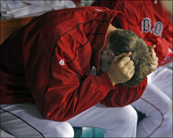 Red Sox closer Jonathan Papelbon is upset at himself in the dugout after getting out of the ninth inning, but nor before surrendering a two run home run to Travis Buck.