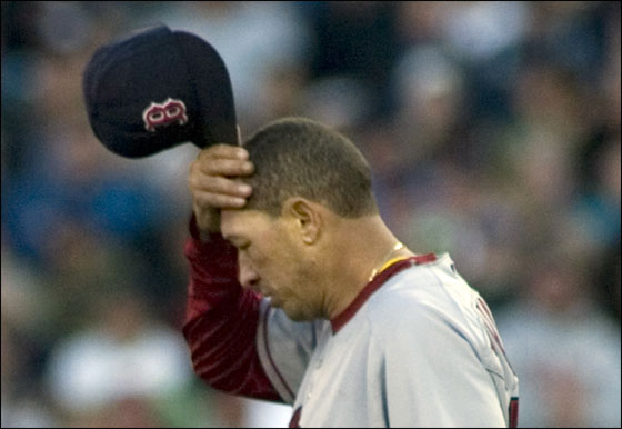 Red Sox pitcher Julian Tavarez reacts to over-throwing first base, allowing Seattle Mariners' Yuniesky Betancourt to reach first in the sixth inning of their Major League Baseball game Monday, June 25, 2007 in Seattle.
