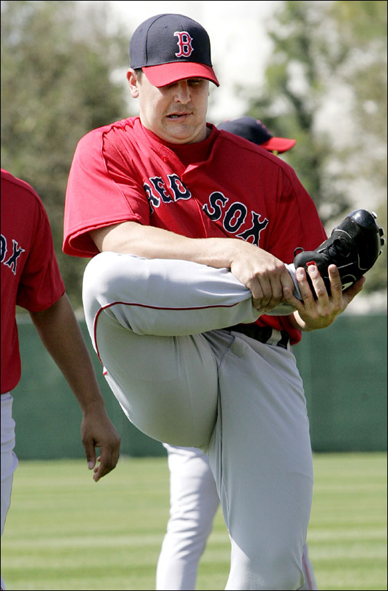 Boston Red Sox pitcher Keith Foulke stretches his leg as baseball spring training workouts began for pitchers and catchers Sunday, Feb. 19, 2006, in Fort Myers, Fla.