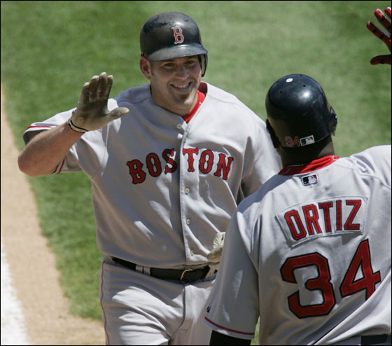 Kevin Youkilis was congratulated at home plate by David Ortiz after hitting a home run in the fifth inning.