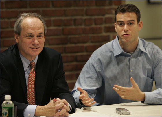 Larry Lucchino, president/CEO and Theo Epstein, executive vice president/general manager, get together to discuss the details of Theo's return to the Red Sox during a morning press conference at Fenway Park.