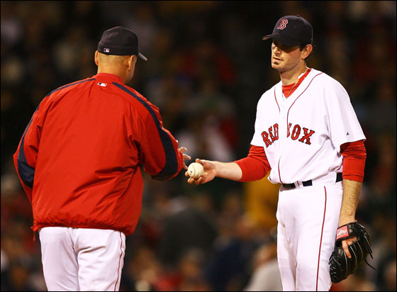 Matt Clement of the Red Sox hands the ball to Manager Terry Francona and leaves the game in the fifth inning against the New York Yankees on May 24, 2006 at Fenway Park in Boston, Massachusetts.