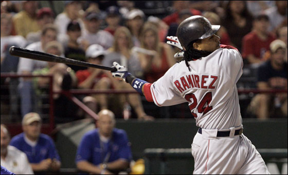 Red Sox Manny Ramirez follows through on his triple against the Texas Rangers during the sixth inning of their MLB American League baseball game in Arlington, Texas May 26, 2007.