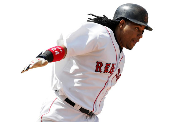 Manny Ramirez #24 of the Boston Red Sox rounds first after he hit a three run home run in the first inning against the Chicago White Sox on July 22, 2007 at Fenway Park 