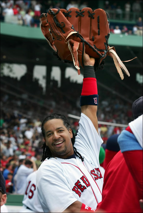 Red Sox Manny Ramirez holding Wally The Green Monster's glove during pregame against the San Francisco Giants at Fenway Park on Sunday June 17, 2007.