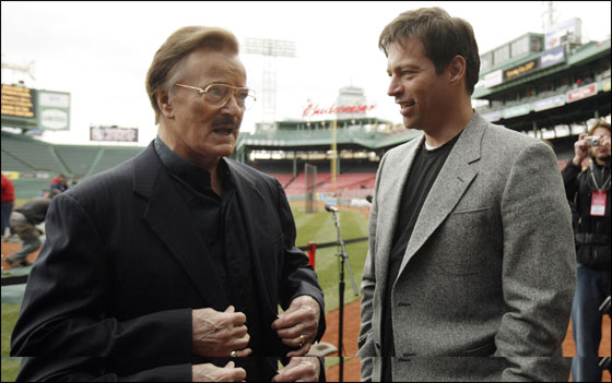 Singers Robert Goulet (Left) and Harry Connick Jr. talk prior to the American League baseball game between the Boston Red Sox and the Seattle Mariners at Fenway Park in Boston, Massachusetts April 10, 2007. Goulet and Connick Jr will perform as part of the pre-game ceremonies for the Red Sox home opener.