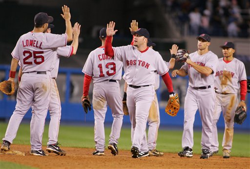 Members of the Boston Red Sox celebrate after defeating the New York Yankees 5-4 in the second game of a double header baseball game, Sunday, Sept. 17, 2006, at Yankee Stadium in New York.
