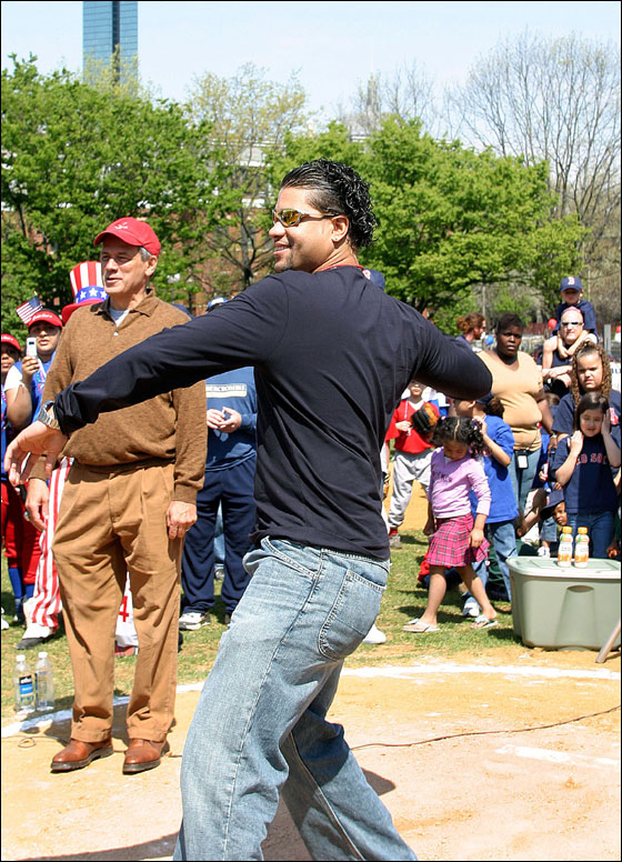 Red Sox pitcher and South End Youth Baseball alumni Manny Delcarmen throws out the first pitch during opening Day ceremonies of the 20th season of South End Youth Baseball at Peters Park in the South End of Boston.