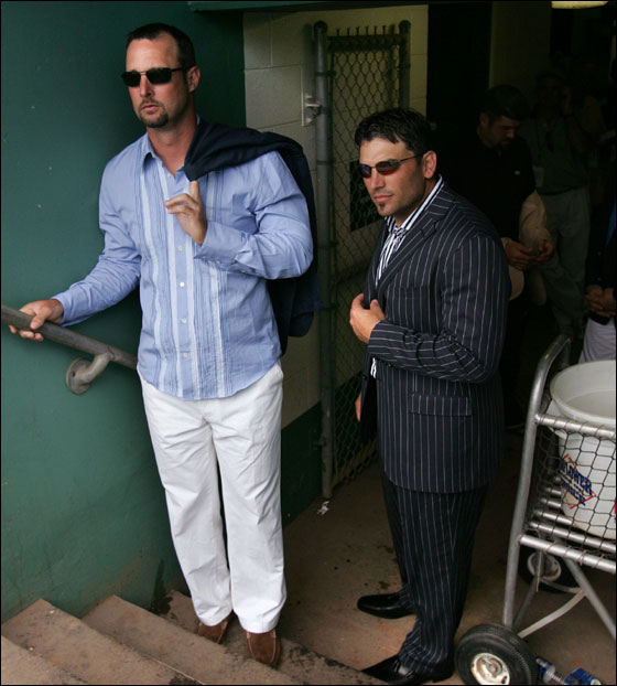 Boston Red Sox pitcher Tim Wakefield, left, and catcher Doug Mirabelli, right, wait in the dugout to be introduced as the makeovers for five Red Sox players were unveilled after a game against the St. Louis Cardinals in Fort Myers, Fla., Wednesday March 16, 2005. Five Red Sox players took part in the show Queer Eye for the Straight Guy