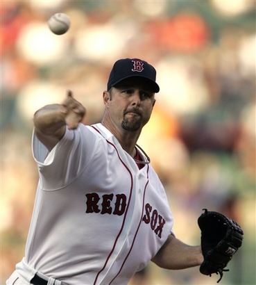 Boston Red Sox's Tim Wakefield delivers a pitch in the first inning of a baseball game against the Colorado Rockies in Boston, Tuesday, June 12, 2007.