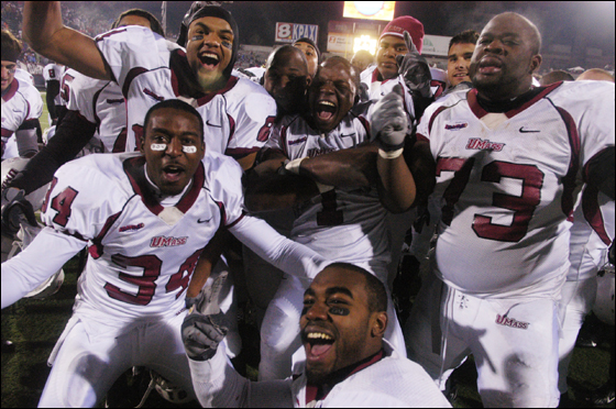 Massachusetts football players celebrate in front of the televison cameras in Missoula, Mont., Friday, Dec. 8, 2006, after defeating Montana 19-17 in an NCAA Division I-AA semifinal.