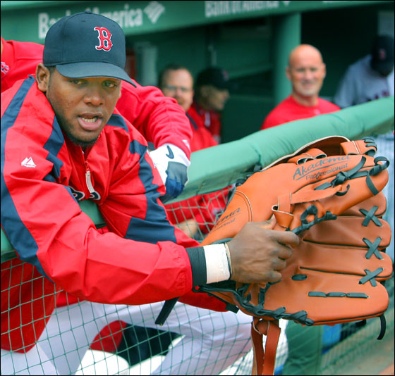 Sometimes defensively challenged Red Sox outfielder Wily Mo Pena may have found a cure for what ails him, a giant glove. Actually, he was trying on an oversized mitt in the dugout before the game that belonged to Boston mascot Wally the Green Monster.