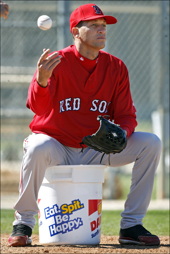 Red Sox reliever Julian Tavarez may have created a minor uproar with his comments regarding the arrival date of teammate Manny Ramirez, but today he was relaxed as he sat on a sunflower seed pail and fed balls too coach Brad Mills who was hitting ground balls to pitchers.