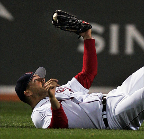 Red Sox center fielder Adam Stern shows the ball in his glove after making a diving catch on a fly ball by Tampa Bay Devil Rays Damon Hollins for the final out in the ninth inning of their baseball game at Fenway Park in Boston Tuesday, April 18, 2006. The Red Sox won, 7-4.