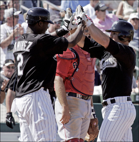 Florida Marlins' Hanley Ramirez (No. 2) celebrates with Dan Uggla at the plate following Uggla's two run homer that scored Ramirez in the fifth inning of their spring training baseball game in Jupiter, Fla. Wednesday, March 8, 2006.