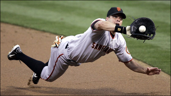 First baseman J.T. Snow of the San Francisco Giants tries to catch a line drive hit by Xavier Nady of the San Diego Padres in the first inning on July 1, 2005 at PETCO Park in San Diego.