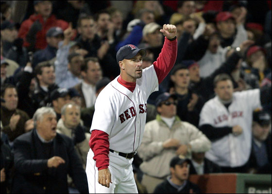 Red Sox third base coach Dale Sveum waves home a runner during a game vs. the Yankees at Fenway Park April 14, 2005.