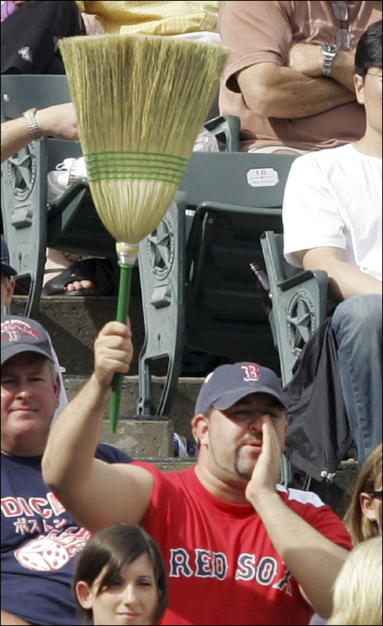 A Boston Red Sox fans holds up a broom in the ninth inning of the baseball game against the Texas Rangers in Arlington,Texas, Sunday, May 27, 2007. The Red Sox completed a three-game sweep over the Rangers with a 6-5 win.