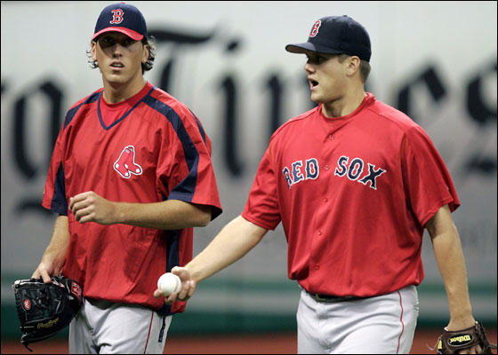 Red Sox 2005 first-round draft pick Craig Hansen, left, walks with pitcher Jonathan Papelbon while the team takes batting practice before their game with the Tampa Bay Devil Rays Monday night in St. Petersburg, Fla.