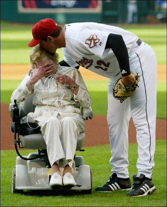 Houston Astros pitcher Roger Clemens kisses his mother Bess on the head as she cries after throwing out the first pitch during pre-game ceremonies  April 9, 2005 in Houston. The 22-year MLB veteran donated his seventh Cy Young trophy to Houston fans to be put on permanent display inside Minute Maid park.
