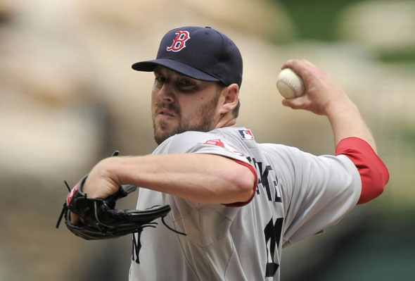 John Lackey throws to the plate during the third inning of their Major League Baseball game against the Los Angeles Angels, Sunday, April 24, 2011, in Anaheim, Calif. 