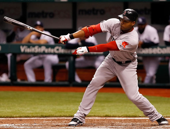 Carl Crawford of the Boston Red Sox fouls off a pitch against the Tampa Bay Rays during the game at Tropicana Field on June 14, 2011 in St. Petersburg, Florida