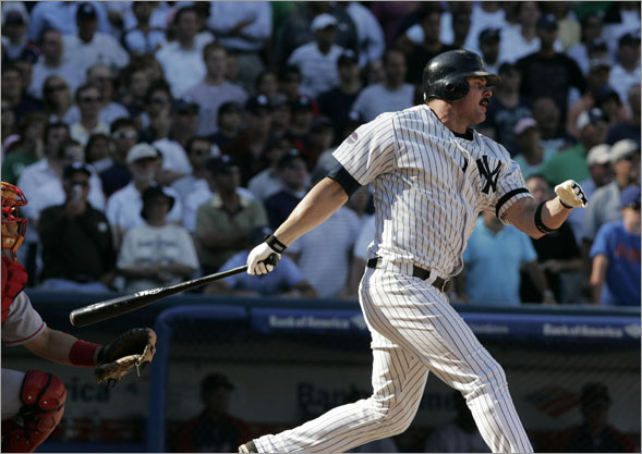 Jason Giambi follows through on a single to drive in the winning run in the ninth inning on Thursday afternoon.