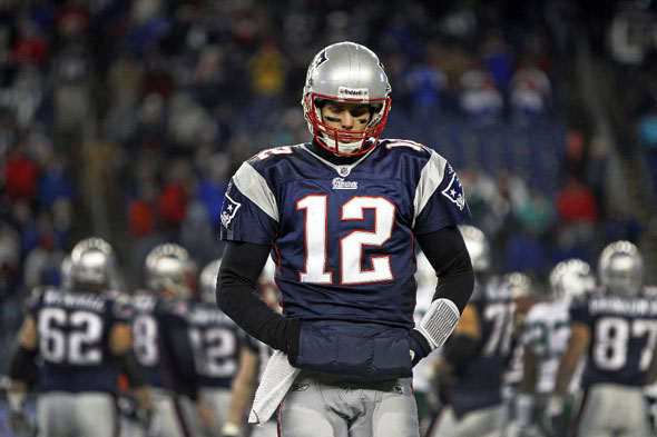 Patriots quarterback Tom Brady walks to the bench after his final play of ther season. The New England Patriots hosted the New York Jets in an NFL AFC Playoff Game at Gillette Stadium