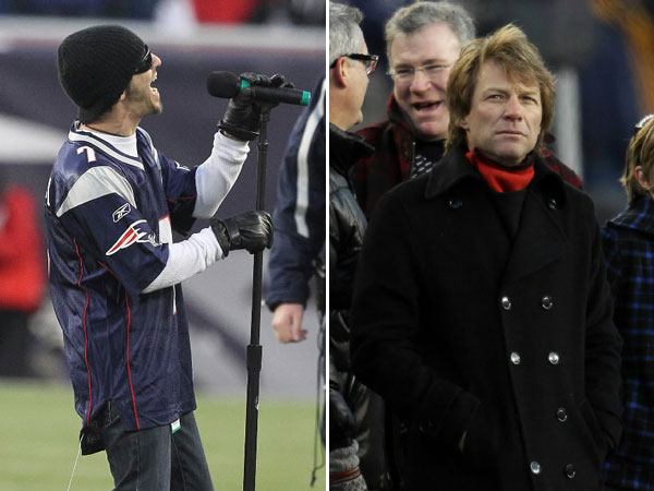 Lead singer of Godsmack Sully Erna sings the National Anthem at the New England Patriots game against New York Jets at Gillette Stadium. Bon Jovi stands on the sidelines.