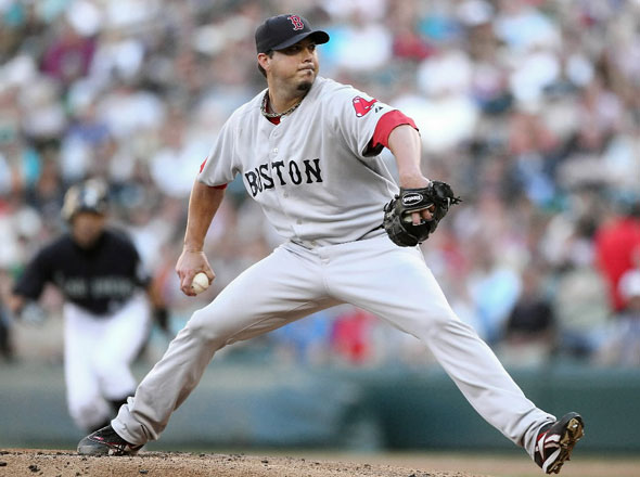 Starting pitcher Josh Beckett #19 of the Boston Red Sox pitches against the Seattle Mariners at Safeco Field
