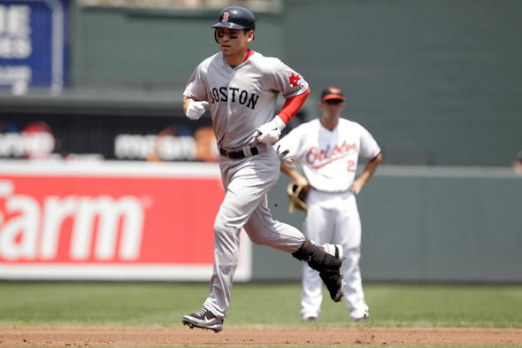 Jacoby Ellsbury of the Boston Red Sox rounds the bases after hitting a solo home run during the third inning at Oriole Park at Camden Yards on July 20, 2011 in Baltimore, Maryland