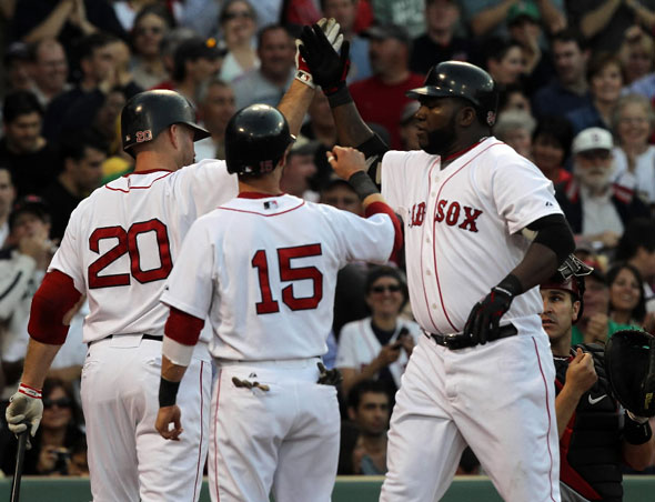 Boston Red Sox designated hitter David Ortiz is congratulated at the plate after hitting a 2 run HR in the 1st. 