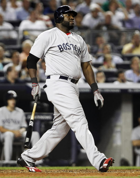 David Ortiz watches the flight of his two-run home run during the fifth inning of American League MLB baseball action against the New York Yankees at Yankee Stadium in New York June 7, 2011.